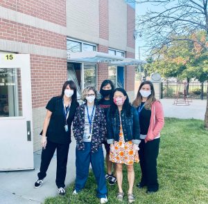 Staff in masks at school